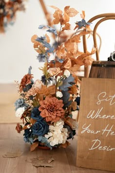 a bouquet of flowers sitting on top of a wooden table