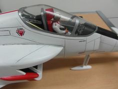 a toy airplane with a man in the cockpit