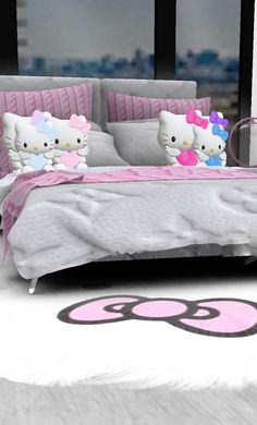 a hello kitty bedroom with pink and white bedding