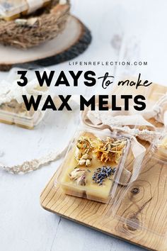 three wax melts sitting on top of a wooden cutting board