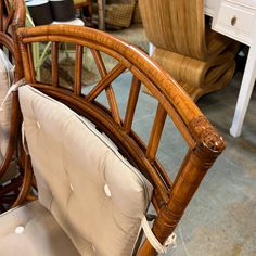 a close up of a chair with cushions on it's back and the seat cushion removed