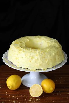 there is a cake with lemons on the table