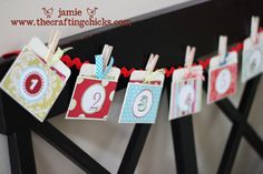 some clothes pins are hanging on a clothes line with name tags attached to the clothes pegs