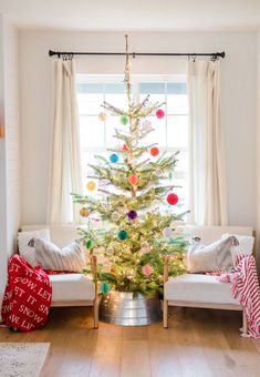 a decorated christmas tree in a living room