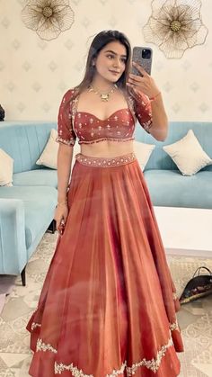 Simple Engagement Look Indian, Blouse Patterns For Ghagra, Orange Red Lehenga, Contemporary Lehenga Designs, Haldi Skirt And Top, Rust Red Lehenga, Wedding Season Outfit Indian, Ghagra Choli For Wedding, Banarasi Chaniyacholi