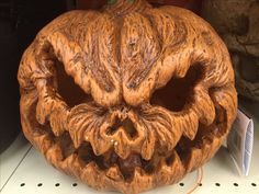 a carved pumpkin with an evil face on it