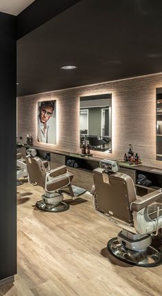 a hair salon with chairs and mirrors on the wall next to it's counter