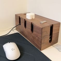 a computer mouse sitting on top of a wooden box