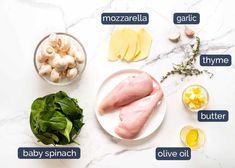 ingredients to make chicken broth laid out on a marble counter top, including eggs, spinach, garlic, and mushrooms