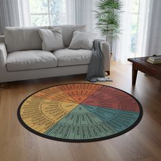 a living room with a couch and a large wheel of numbers rug on the floor