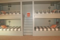 two bunk beds in a room with no curtains on the top and bottom bunkbeds