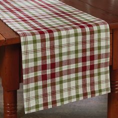 a table with a red and green checkered table cloth on it