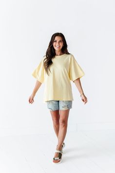 Features Round Neck Short Sleeves Pastel Yellow Color 100% Cotton Size + Fit Small 0-4, Medium 4-8, Large 8-12 Kristin is 5'4", a size 1 and is wearing a Small Oversized fit, size down if you want less oversized. Above recommendation is for an oversized fit. Click here for shorts in photos Click here for shorts in Aimee's try on video