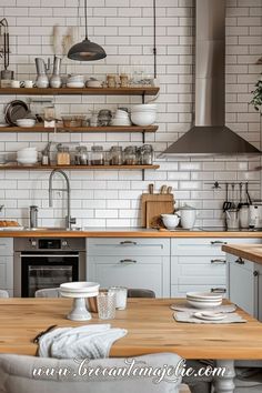 the kitchen is clean and ready to be used for cooking or baking, while also being used as a dining area