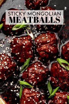 meatballs with sesame seeds in a bowl on a wooden table and the words sticky mongolian meatballs above it