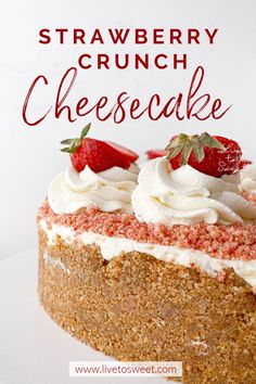 a strawberry crunch cheesecake with whipped cream and strawberries on top