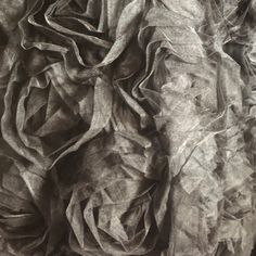 black and white photograph of wrinkled fabric