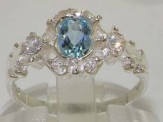 "*This ring is made from 925 Sterling Silver with Genuine Natural Aquamarine & Cubic Zirconias . This stunning ring has been set with a center 6x4mm (0.24\" x 0.16\") Aquamarine and two Sparkling White Cubic Zirconias on the shoulders measuring 2.25mm (0.09\").  The contrast of the Vibrant Blue Aquamarine with these Sparkling Cubic Zirconia's set within this delicate yet strong setting, creates such an elegant look and feel, this ring is certainly a very special piece. The design is such that it has a dainty appearance yet the large central stone is very vivid and eye-catching, therefore it is a beautiful ring to wear comfortable, noticeable yet not overpowering. PLEASE MAKE SURE YOU STATE THE FINGER SIZE YOU REQUIRE WITH YOUR PAYMENT AND PROVIDE YOUR TELEPHONE NUMBER FOR DELIVERY COURIER. Pave Ring, Natural Aquamarine, Delicate Rings, Dream Jewelry, Pretty Jewellery, Sparkle Diamonds, Victorian Style, Promise Ring, Cute Jewelry