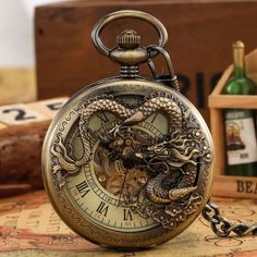 Description: Personalized Appearance: The pocket watch case is exquisitely with a dragon pattern, which is very charming and cool. Durable Movement: This is a hand-winding mechanical watch can keep work by daily manual movement without the batteries are required. Adjust Time: Just pull out the crown on the top of the case and then rotate it clockwise gently until reach the time you want. Beautiful Ornament: It is more than a pendant watch that you can even wear it as a exquisite decoration. Bett Steampunk Dragon, Steampunk Pocket Watch, Bronze Dragon, Mechanical Pocket Watch, Pocket Watch Antique, Clock Gift, Fob Watch, Pendant Watches, Antique Pendant