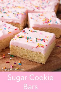 a close up of a cake with frosting and sprinkles on it