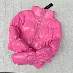 Pink Nylon Puffer Jacket For Spring, Pink Nylon Puffer Outerwear, Casual Pink Nylon Puffer Jacket, Pink Nylon Puffer Jacket For Fall, Trendy Solid Nylon Outerwear, Pink Nylon Outerwear With Zipper Closure, Pink Nylon Outerwear For Fall, Trendy Pink Hooded Puffer Jacket, Pink Winter Puffer Outerwear