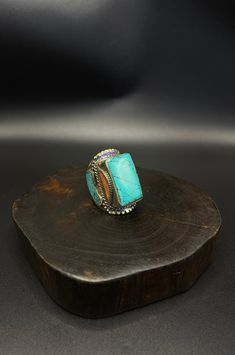 vintage handcrafted Tibetan Nepalese ring with turquoise and coral stone Traditional Blue Turquoise Collectible Ring, Artisan Multi-stone Turquoise Ring, Adjustable Traditional Turquoise Ring, Bohemian Turquoise Multi-stone Rings, Artisan Multicolor Turquoise Ring With Natural Stones, Adjustable Bohemian Turquoise Ring With Stone Setting, Unique Turquoise Ring For Gift, Spiritual Turquoise Ring With Natural Stones, Turquoise Multi-stone Ring For Gift