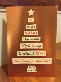 a christmas card with the names of different languages on it and a star in the middle