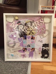 a wedding shadow box with the word mr and mrs surrounded by various items in it