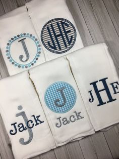 three personalized towels with monogrammed designs on them