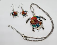 "Stunning turtle pendant, necklace, and earring set. 18\" necklace with extra 2 inches adjustable." Adjustable Multicolor Metal Jewelry Sets, Halloween Coffin, Turtle Pendant, Stretched Ears, Necklace And Earring Set, Black Earrings, Perfect Pair, Earring Set, Jewelry Sets