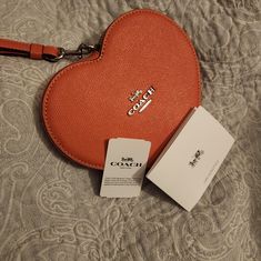 Brand New Coach Bag/Wristlet/Purse Heart Shaped Still Has Tag (Detached) And Care Instructions Inside Compact Coach Wallet As Gift, Coach Pouch Clutch Gift, Coach Clutch Gift Pouch, Coach Pouch Clutch As Gift, Coach Clutch Wallets For Gifts, Handheld Wallets As Gifts, Chic Coach Wallets For Gift, Wristlet With Removable Pouch As Gift, Elegant Wristlet With Card Slots For Gift