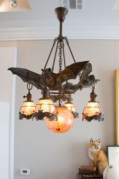 a bird chandelier hanging from the ceiling