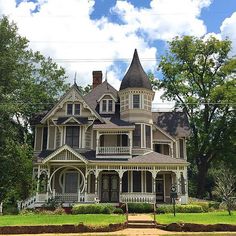 an old victorian style house in the country