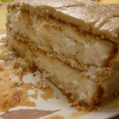 a close up of a piece of cake on a plate with one slice cut out