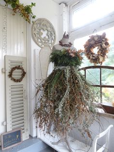 a dress made out of twigs and other plants