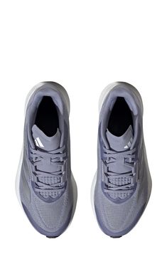 A breathable mesh upper promotes airflow in an athletic sneaker designed for running that's built with plush cushioning and a lightweight, flexible sole. Lace-up style Synthetic and textile upper/textile lining/synthetic sole
 Imported Silver Sneakers With Boost Midsole, Silver Sneakers With Boost Midsole For Errands, Silver Mesh Running Shoes With Boost Midsole, Adidas Breathable Low-top Trail Running Shoes, Gray Mesh Running Shoes With Boost Midsole, Adidas Mesh Athleisure Running Shoes, Silver Mesh Sneakers With Boost Midsole, Gray Running Shoes With Boost Midsole For Training, Silver Running Sneakers With Boost Midsole