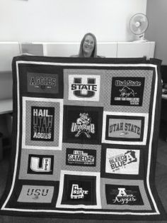 a woman is holding up a quilt made from old t - shirts