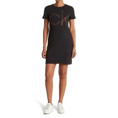 A Stylish Embellished Logo T-Shirt Dress Is A Glam Yet Laid Back Addition To Your Wardrobe! 34" Length (Size S); Crew Neck; Short Sleeves; Chest Rhinestone Embellished Logo Design; Solid; 95% Cotton, 5% Spandex; Machine Wash, Tumble Dry. Imported. Size: Large Fitted Short Sleeve Calvin Klein T-shirt, Casual Crew Neck Sequin Dress, Fitted Calvin Klein Short Sleeve T-shirt, Long Sleeve Satin Dress, Maternity Sweater Dress, Grey Knit Dress, Wrap Sweater Dress, Long Sleeve Ruffle Dress, All Black Dresses