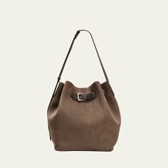 Brunello Cucinelli bucket bag in soft velour leather  Adjustable shoulder strap Open top with adjustable buckle strap  Approx. 12.2"H x 10.2"W x 6.7"D Made in Italy Open Top, Brunello Cucinelli, Bucket Bag, Tops Designs, Shoulder Strap, In Italy, Buckle, Italy, Luxury Fashion