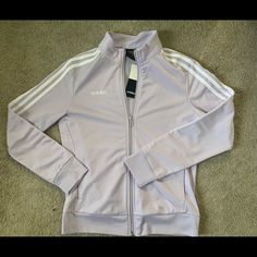 Adidas 3-Stripes Zip Up Track Women Jacket Purple White Fm6638 100% Authentic, Brand New With Tags Women Size: Small Style # Fm6638 Product Details: Perfect For Keeping Your Muscles Warm, This Essential Zip Up Track Jacket With The Signature 3-Stripes Detail Is Sure To Be Your Next Go-To. - Stand Collar - Long Sleeves - Front Zip Closure - Side Slash Pockets - 3-Stripes Trim - Logo Detail Comes From Smoke And Animal Free Home! Thanks For Looking! Spring Track Jacket With Contrast Stripes, Spring Track Jacket With Contrast Stripes And Long Sleeves, Spring Sports Track Jacket With Three Stripes, White Track Jacket With Contrast Stripes For Winter, White Winter Track Jacket With Contrast Stripes, Casual Track Jacket With Side Stripes For Spring, Spring Casual Track Jacket With Side Stripes, Casual Spring Track Jacket With Side Stripes, Adidas Three Stripes Track Jacket For Spring