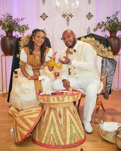 a man and woman sitting next to each other