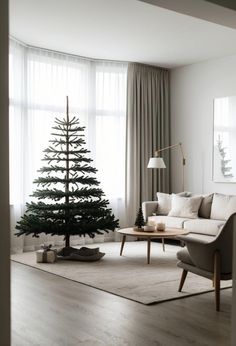 a living room filled with furniture and a christmas tree in the middle of the room