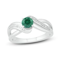 A gorgeous round-cut lab-created emerald boldly glimmers at the center of this elegant ring. Set in classic sterling silver, sparkling round-cut white lab-created sapphires flow down the band to finish the look. Resize Ring, Emerald Blue, White Lab, Lab Created Emerald, Kay Jewelers, Emerald Stone, Elegant Ring, The Band, Ring Sterling Silver