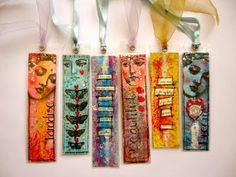 five bookmarks with different designs on them hanging from the wall next to each other