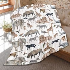 a blanket with different types of animals on it