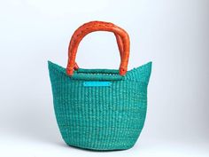 Take the beach with you with our intricately handwoven totes, made in Bolgatanga, Ghana by our talented artisans. Perfect for an overnight stay, brunch, the beach, the market or any occasion. Body woven with straw and elephant grass Handles 100% leather Made in Ghana *Each tote is handmade so no two are alike...dimensions vary Mini Tote Colors in stock: Turquoise Red Black Fuschia Yellow Apple Green Orange Purple Multi Print Classic 1 Tote Colors in Stock: Solid Red Solid Black Solid Navy Solid Yellow Solid Fuschia Solid Tan Akataasia Colors in Stock: Green Yellow Fuschia Navy Orange Tan Eco-friendly Bucket Beach Bag With Rolled Handles, Eco-friendly Straw Bag With Rolled Handles For Shopping, Eco-friendly Straw Bag With Rolled Handles, Eco-friendly Fair Trade Bucket Beach Bag, Beach Bag With Braided Handles For Market, Fair Trade Bucket Beach Bag For Travel, Natural Fiber Beach Bag With Braided Handles For Market, Eco-friendly Natural Fiber Beach Bag With Rolled Handles, Handmade Bucket Bag For Beach Shopping