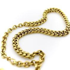 This is part of Chairish’s Fine Jewelry assortment.  This 14k gold watch chain has a fabulous hollow link interwoven with tiny balls for an unusual variation of a curb link. The links are carved with a ribbed texture that give a matte surface to the gold. This creates a unique visual texture that almost gives the illusion that the lines of the chain are blurry or out of focus. The tiny balls add a vertebrae-like element that reinforces the chain and make its movement serpentine.   At each end of Victorian Yellow Gold Jewelry With Curb Chain, Antique Jewelry With Oval Link Curb Chain, Victorian Yellow Gold Curb Chain Necklace, Victorian Yellow Gold Necklace With Curb Chain, Antique Curb Chain Necklaces For Formal Occasions, Antique Curb Chain Necklace With Oval Links, Antique Curb Chain Necklace For Formal Occasions, Victorian Style Necklace With Curb Chain Link, Vintage Yellow Gold Curb Chain Necklace