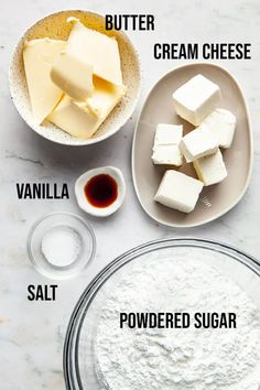 ingredients needed to make homemade cheesecakes on a white marble counter top, including butter, vanilla, powdered sugar and salt