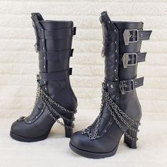 4" (102mm) Block Heel, 3/4" (19mm) Platform Mid-Calf Boot W/ Coffin Buckle Straps, Skull Patch & Lace Embellished Quilted Front Panel W/ Studs & Swivel Hook Cascading Chain Detail, Metal Back Zip Closure New In Box Authentic Demonia Demonia Boots, Gothic Boots, Skull Patch, Demonia Shoes, Swivel Hook, Black Platform Boots, Leather Heeled Boots, Girly Shoes, Foot Bed