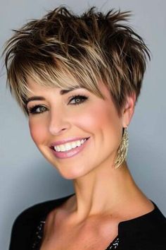 Want to add a pop of color to your pixie cut? Explore trendy color ideas for every season and find your perfect match. #pixiecut #haircolor #trends #beauty The Back Of Short Haircuts, Asymmetrical Pixie Cuts